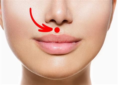 Ilustrácia znázorňujúca bod na tvári medzi nosom a hornou perou